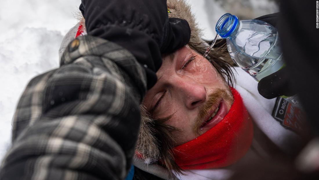 A protester&#39;s eyes are washed out after being affected by a chemical irritant fired by police on February 19.