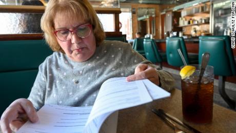 Marjorie Block, president of the Saugerties Historical Society, looks through documents at the Village Diner.