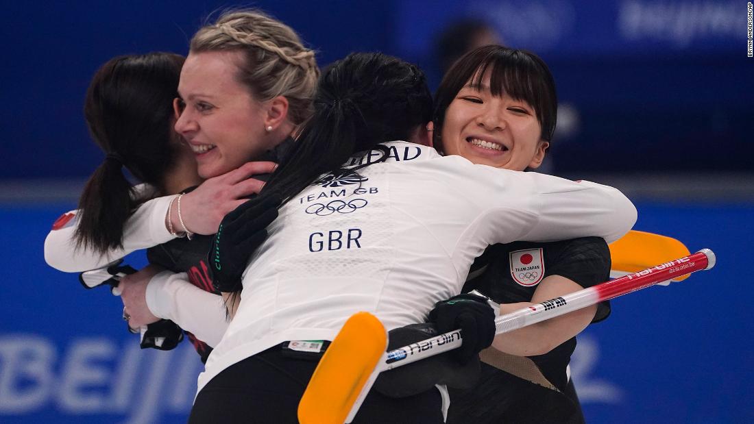Athletes from both teams hug after the curling final between Japan and Great Britain on February 20. It was Great Britain&#39;s &lt;a href=&quot;https://www.cnn.com/world/live-news/beijing-winter-olympics-02-20-22-spt/h_1e0312d42a548ef11313678be9a87b61&quot; target=&quot;_blank&quot;&gt;only gold medal&lt;/a&gt; of these Olympics.