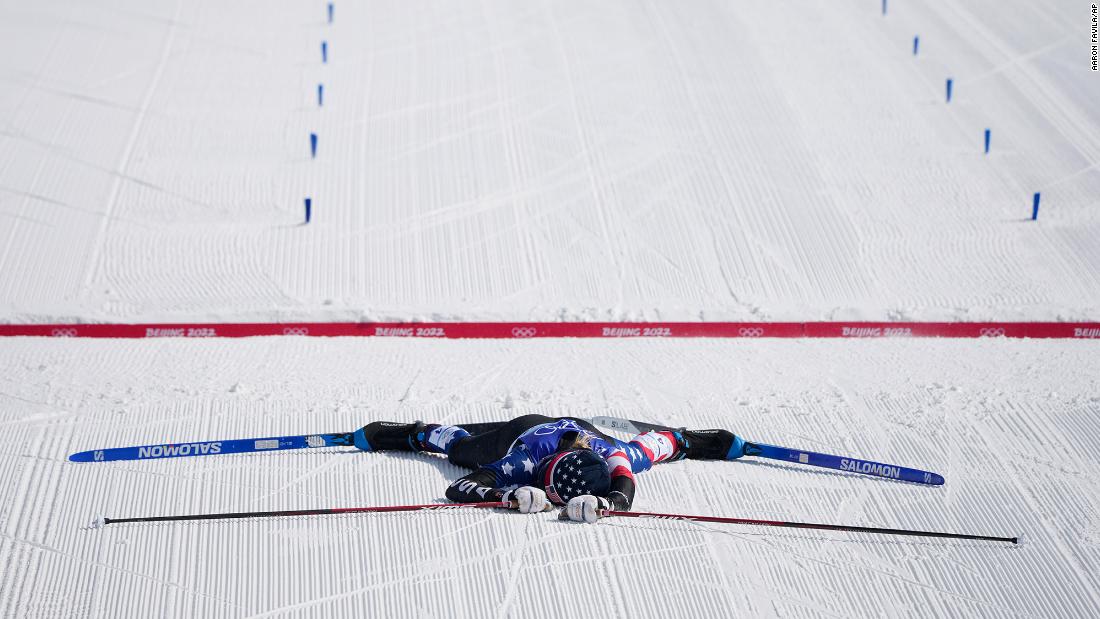 American cross-country skier Jessie Diggins lies on the snow after crossing the finish line of the 30-kilometer mass start event on February 20. She won the silver, finishing behind Norway&#39;s Therese Johaug, &lt;a href=&quot;https://www.cnn.com/world/live-news/beijing-winter-olympics-02-20-22-spt/h_459dffb5602658671f58821f247f24ec&quot; target=&quot;_blank&quot;&gt;and she revealed that she had been suffering from food poisoning&lt;/a&gt; just 30 hours beforehand.