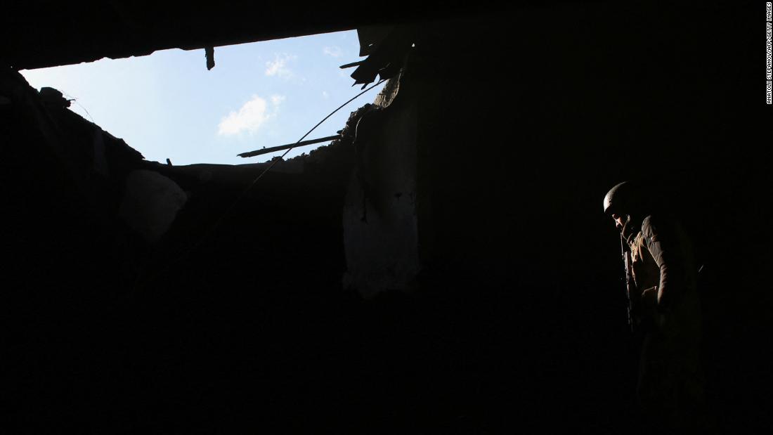 A Ukrainian soldier stays on position on the front line near Novohnativka on February 20. 