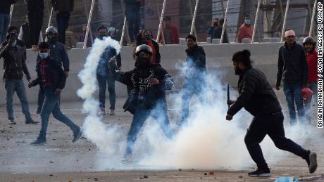 Nepalese police used tear gas and water cannons to disperse protests against the 