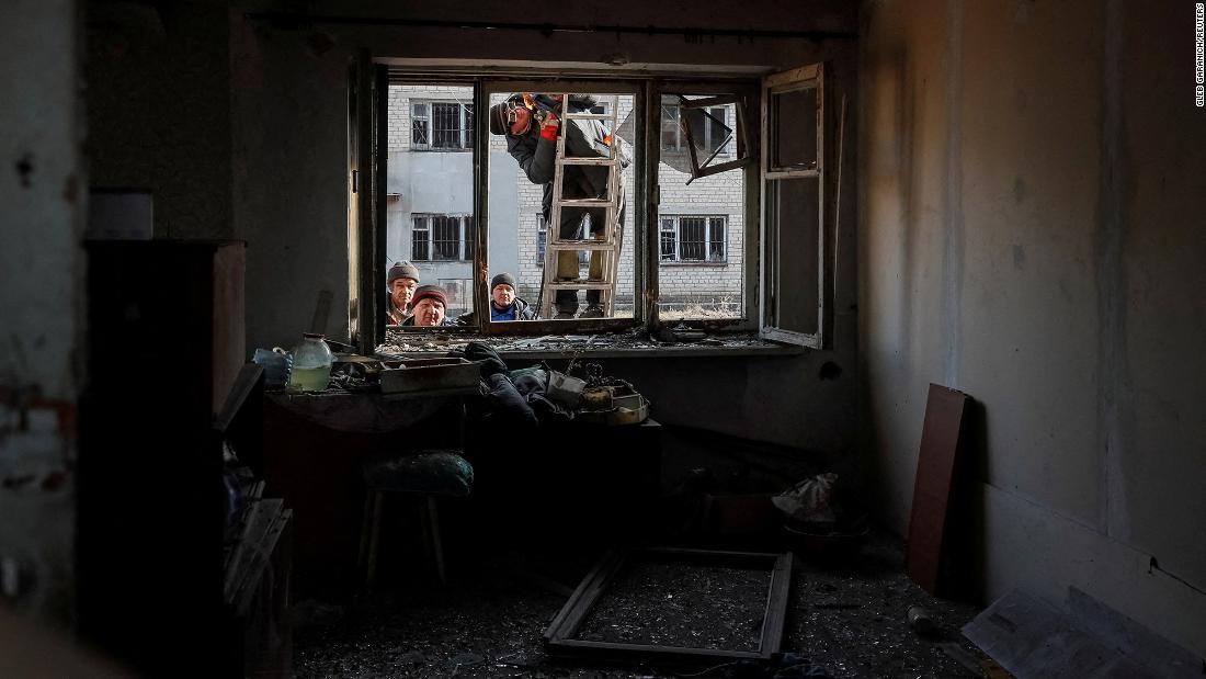 A damaged house is worked on after shelling near the front-line city of Novoluhanske in Ukraine&#39;s Donetsk region on February 22.
