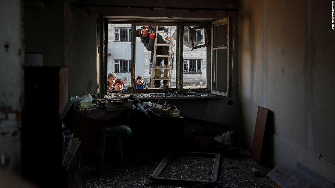 A damaged house is worked on after shelling near the front-line city of Novoluhanske in Ukraine&#39;s Donetsk region on Tuesday, February 22.