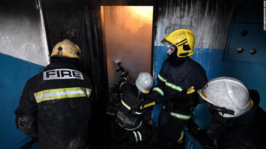 Firefighters attempt to extinguish a fire after a reported strike in Chuhuiv on February 24.