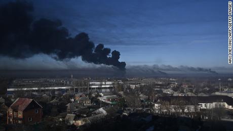 Black smoke rises from a military airport in Chuguyev, near Kharkiv on Thursday.