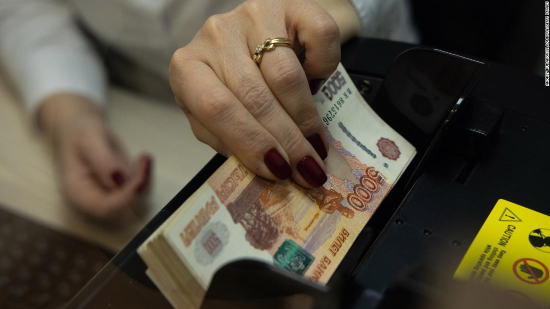 Russian stocks crash, ruble plunges to record low