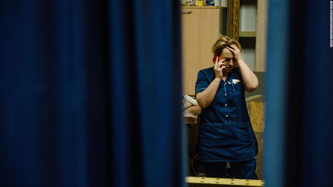 A staff member of a Kyiv hotel talks on the phone on February 24.
