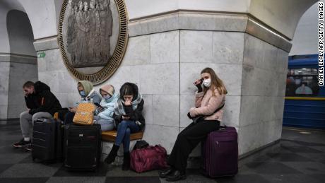 People take shelter in a metro station in Kiev.