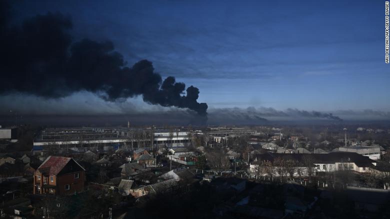 Black smoke rises from a military airport in Chuguyev near Kharkiv on February 24, 2022