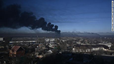 Black smoke rises from a military airport in Chuguyev near Kharkiv on February 24, 2022