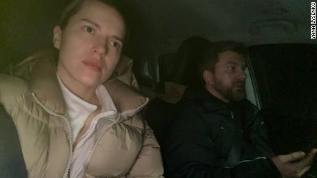 Yana and Sergii Lysenko get into their car.