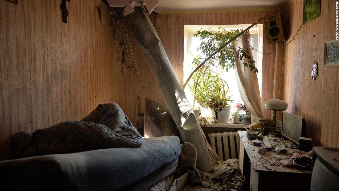 The body of a rocket remains in an apartment after shelling on the northern outskirts of Kharkiv on February 24.