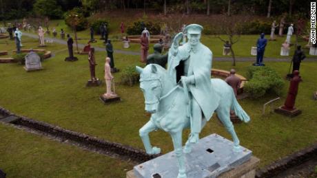 Hundreds of unwanted statues of former president Chiang Kai-shek were moved to a park in Taoyuan city, as Taiwan reflects on his oppressive role during the &quot;white terror&quot; period.
