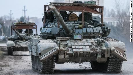 Russian tanks move across the town of Armyansk in northern Crimea. 
