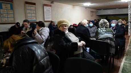 People gather in an air raid shelter in Kyiv, Ukraine on February 24, 2022.  