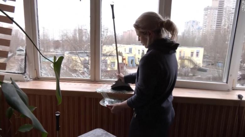 Ukrainians clean up home struck by bombing