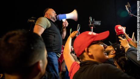 FILE -- Alex Jones, the far-right broadcaster and conspiracy theorist, speaks to supporters of then-President Donald Trump at a rally in Phoenix, Ariz., on Nov. 5, 2020. A superior court in Connecticut on Monday, Nov. 15, 2021, granted a sweeping victory to the families of eight people killed in a 2012 mass shooting at Sandy Hook Elementary School in Newtown, Conn., suing Jones and his Infowars media outlet for defamation. (Adriana Zehbrauskas/The New York Times)