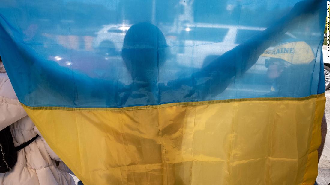 A demonstrator holds a Ukrainian flag in Los Angeles on February 24.