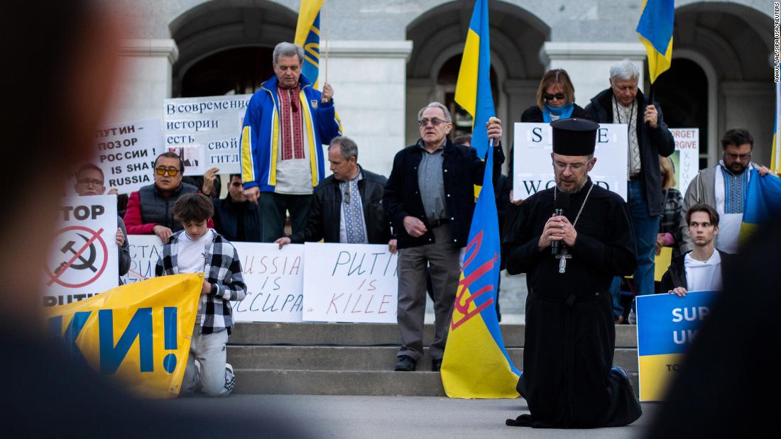 A priest guides a Slavic gathering in prayer at the California State Capitol in Sacramento on February 24.