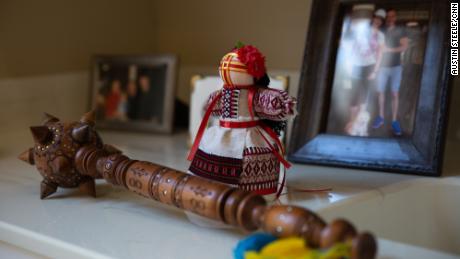 Ukrainian mementos in Alex Podebryi & # 39 ;s home include a bulava club and a handmade motanka doll. 