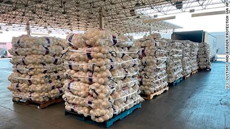 This photo provided by the U.S. Customs and Border Protection shows the Otay Mesa commercial facility where authorities discovered almost 1,200 small packages of methamphetamine hidden within a shipment of onions on Feb. 13, 2022. 