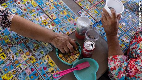 People play lotería for a chance to win prizes at the Pulga Los Portales.