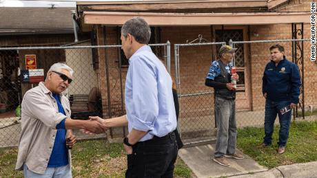 Former Rep. Beto O&#39;Rourke (center left), now running for governor, and Rep. Vicente Gonzalez (right) speak with Robert Lopez (far left) and James Roussett while canvassing a neighborhood in Brownsville.