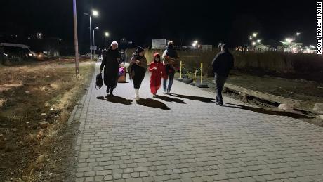 Ukrainian refugees crossing the border into Medyka, Poland.