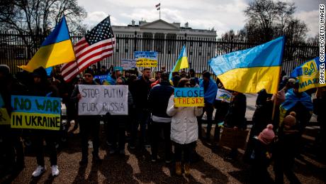 People participate in a pro-Ukrainian demonstration in front of the White House to protest the Russian invasion of Ukraine on February 26 in Washington, DC. 