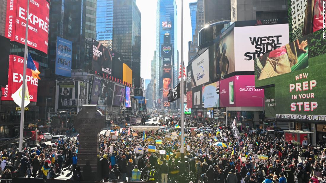 People gather in New York&#39;s Times Square for a &quot;Stand With Ukraine&quot; rally on February 26.