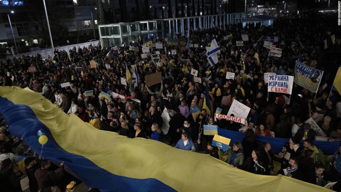 Protesters unveil a Ukrainian flag in Tel Aviv, Israel, on February 26.