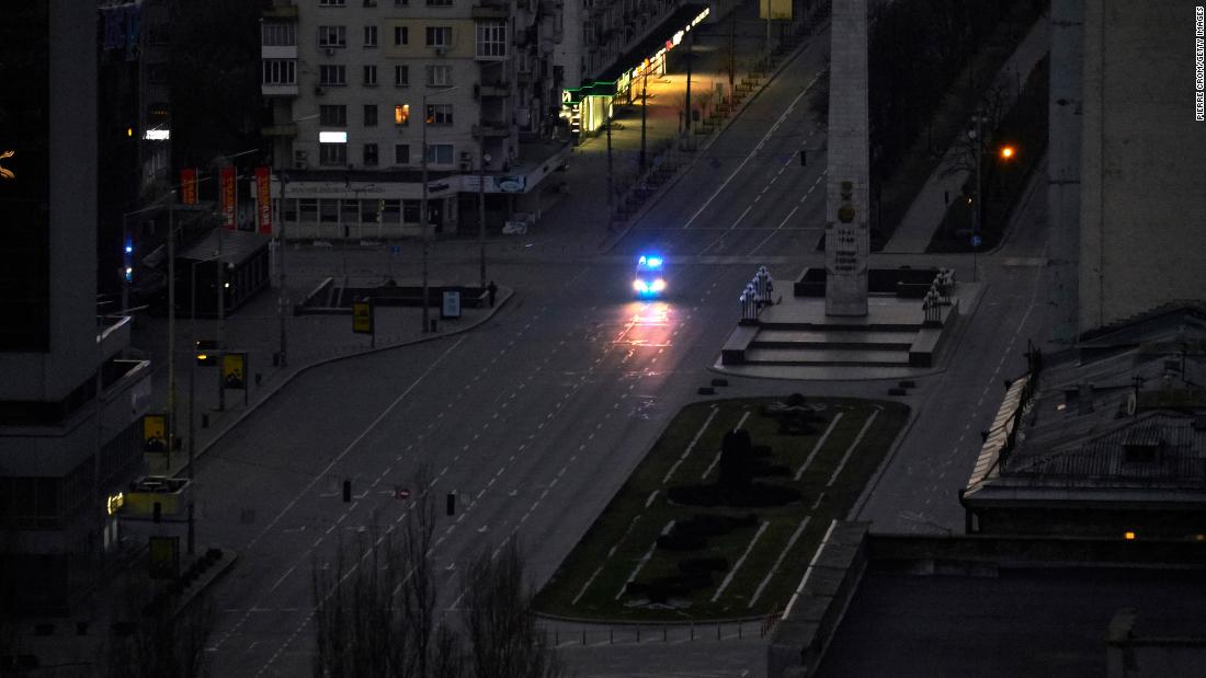 A police vehicle patrols the streets of Kyiv on February 26.