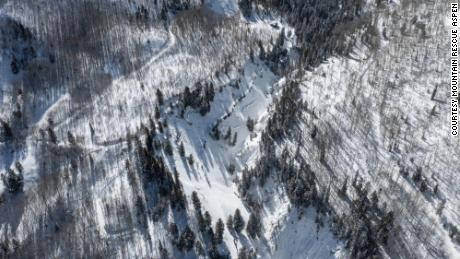 An avalanche released when a snowshoeing group of four people with two dogs traveled along the road on the left side of the gully on Friday, February 25.