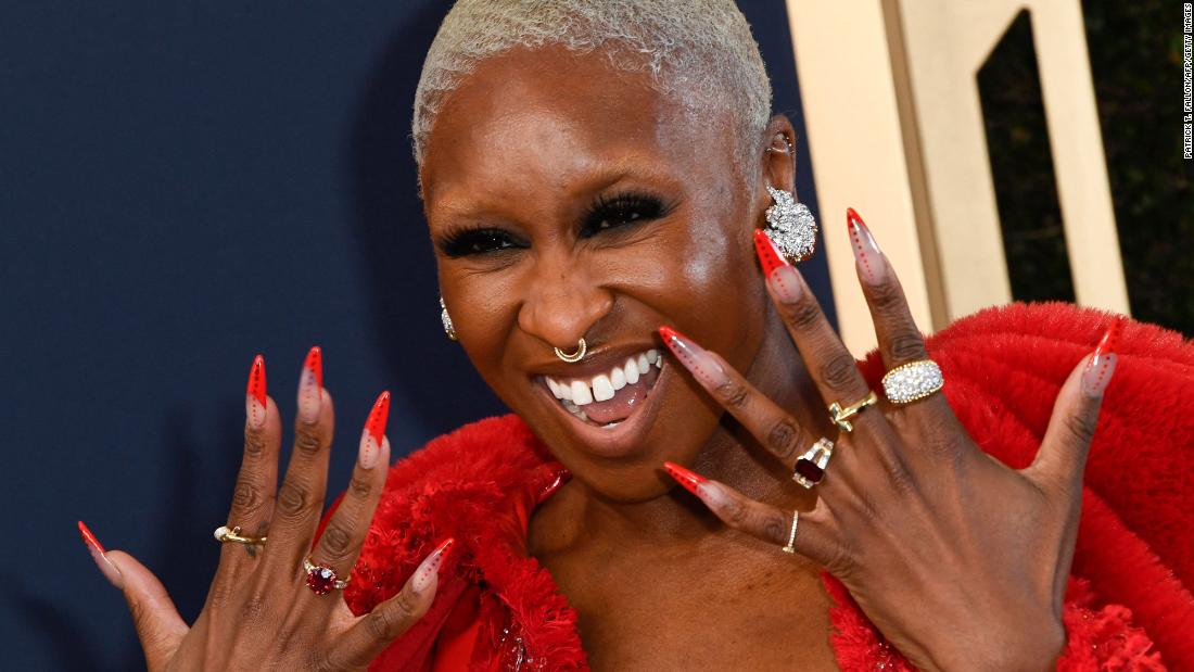 Cynthia Erivo, who plays singer Aretha Franklin in the &quot;Genius&quot; television series, shows off her nails on the silver carpet.
