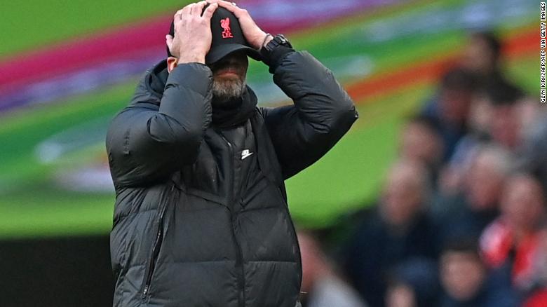 Klopp holds his head as he reacts to his side&#39;s goal being ruled out for offside in the Carabao Cup final. 