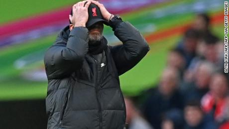 Klopp holds his head as he reacts to his side&#39;s goal being ruled out for offside in the Carabao Cup final. 