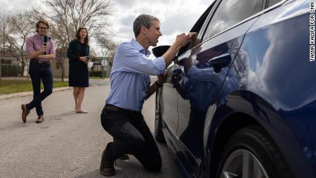 O&#39;Rourke speaks to a motorist while canvassing a neighborhood in Brownsville, Texas, on February 19, 2022.