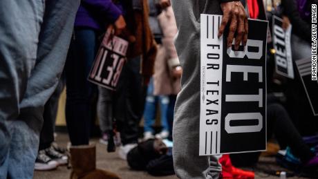 College students carry Beto O&#39;Rourke signs during the rally at Prairie View A&amp;M University on February 25, 2022.