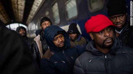 African residents in Ukraine wait on the platform inside Lviv railway station on February 27.  Thousands of people gathered at Lviv's main train station in an attempt to board trains out of Ukraine. 