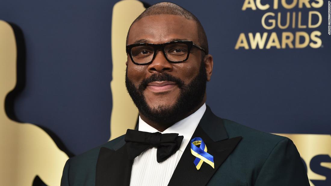 Actor and director Tyler Perry, who was part of the ensemble cast in the film &quot;Don&#39;t Look Up,&quot; wears a ribbon with Ukrainian colors as he arrives for the show. &lt;a href=&quot;http://www.cnn.com/2022/02/14/world/gallery/ukraine-russia-crisis/index.html&quot; target=&quot;_blank&quot;&gt;Ukraine was invaded by Russia&lt;/a&gt; on Thursday.