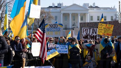 People take part in a protest against the Russian invasion of Ukraine outside the White House in Washington, Sunday, Feb. 27, 2022. (AP Photo/Jose Luis Magana)