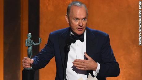 Actor Michael Keaton accepts the award for outstanding performance by a male actor in a television movie or limited series onstage during the 28th Annual Screen Actors Guild (SAG) Awards at the Barker Hangar in Santa Monica, California, on February 27, 2022. 