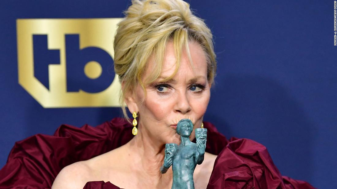Jean Smart, inside the show&#39;s press room, kisses the award she won for outstanding performance by a female actor in a comedy series. The &quot;Hacks&quot; star also was nominated for her role in the miniseries &quot;Mare of Easttown.&quot;
