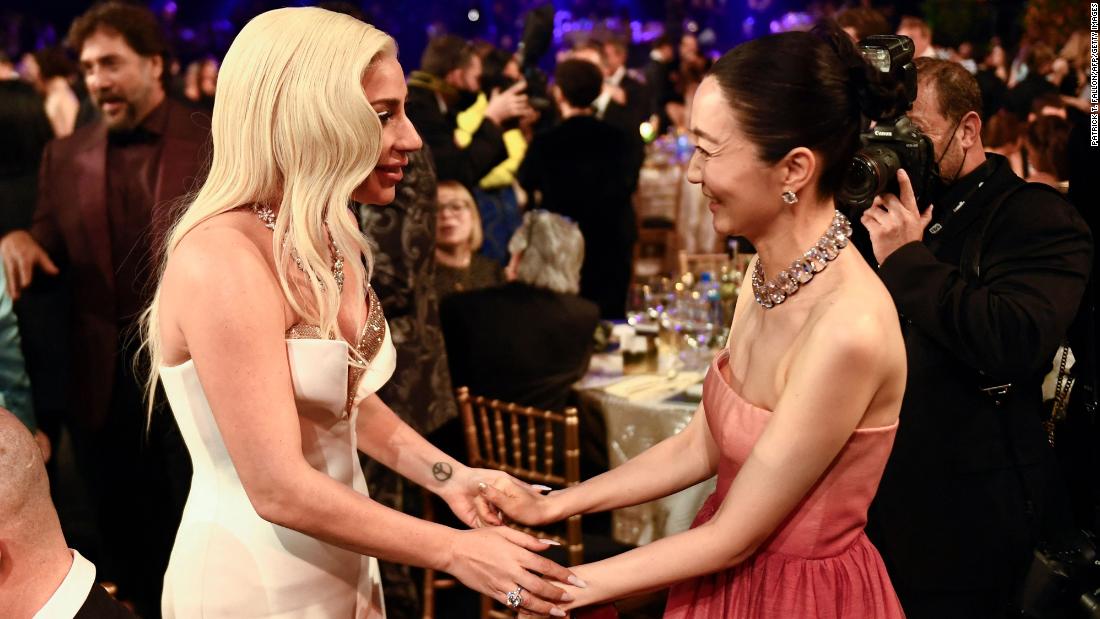Actress and singer Lady Gaga, left, talks with &quot;Squid Game&quot; actress Kim Joo-ryoung during the show. Gaga was nominated for her role in the film &quot;House of Gucci.&quot;
