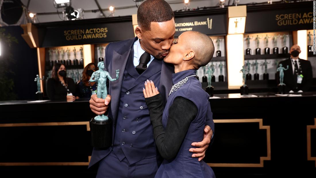 Will Smith kisses his wife, Jada Pinkett Smith, shortly after winning the award for outstanding performance by a male actor in a leading role. He played Richard Williams, the father of tennis greats Serena and Venus Williams, in the film &quot;King Richard.&quot; Venus was in the audience with Smith and other cast members, too.