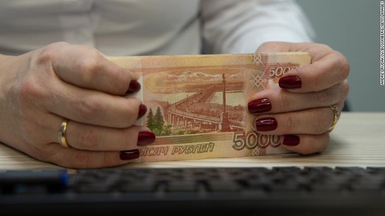 Russia’s ruble crashes as its banking system reels from sanctions
