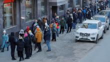 People stand in line to use an ATM money machine in Saint Petersburg, Russia February 27, 2022. REUTERS/Anton Vaganov