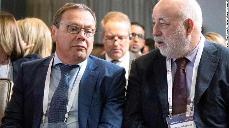 Russian businessman Mikhail Fridman, left, and businessman Viktor Vekselberg talk during a conference in Moscow on September 17, 2019. 