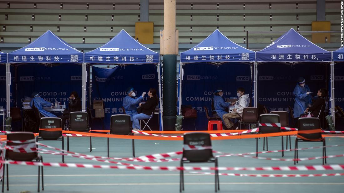 Health care workers collect swab samples at a Covid-19 testing facility in Hong Kong on February 24.